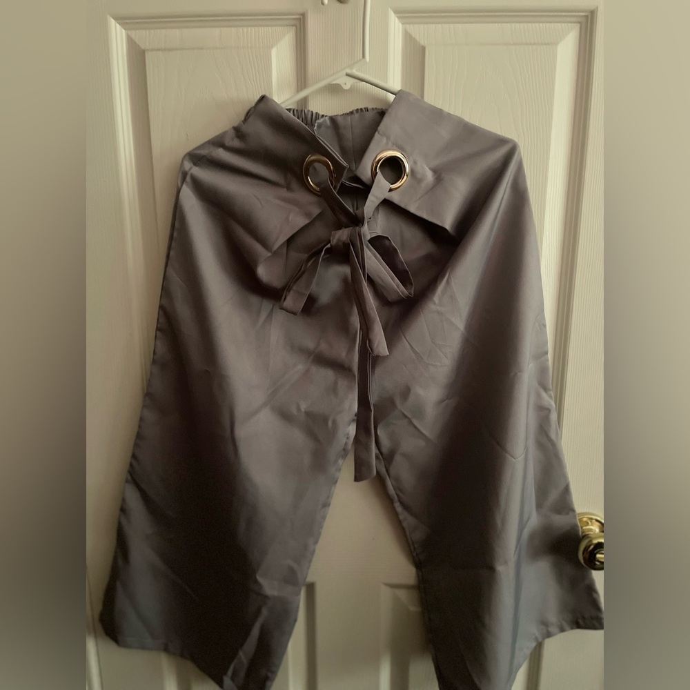 Gray satin pants.